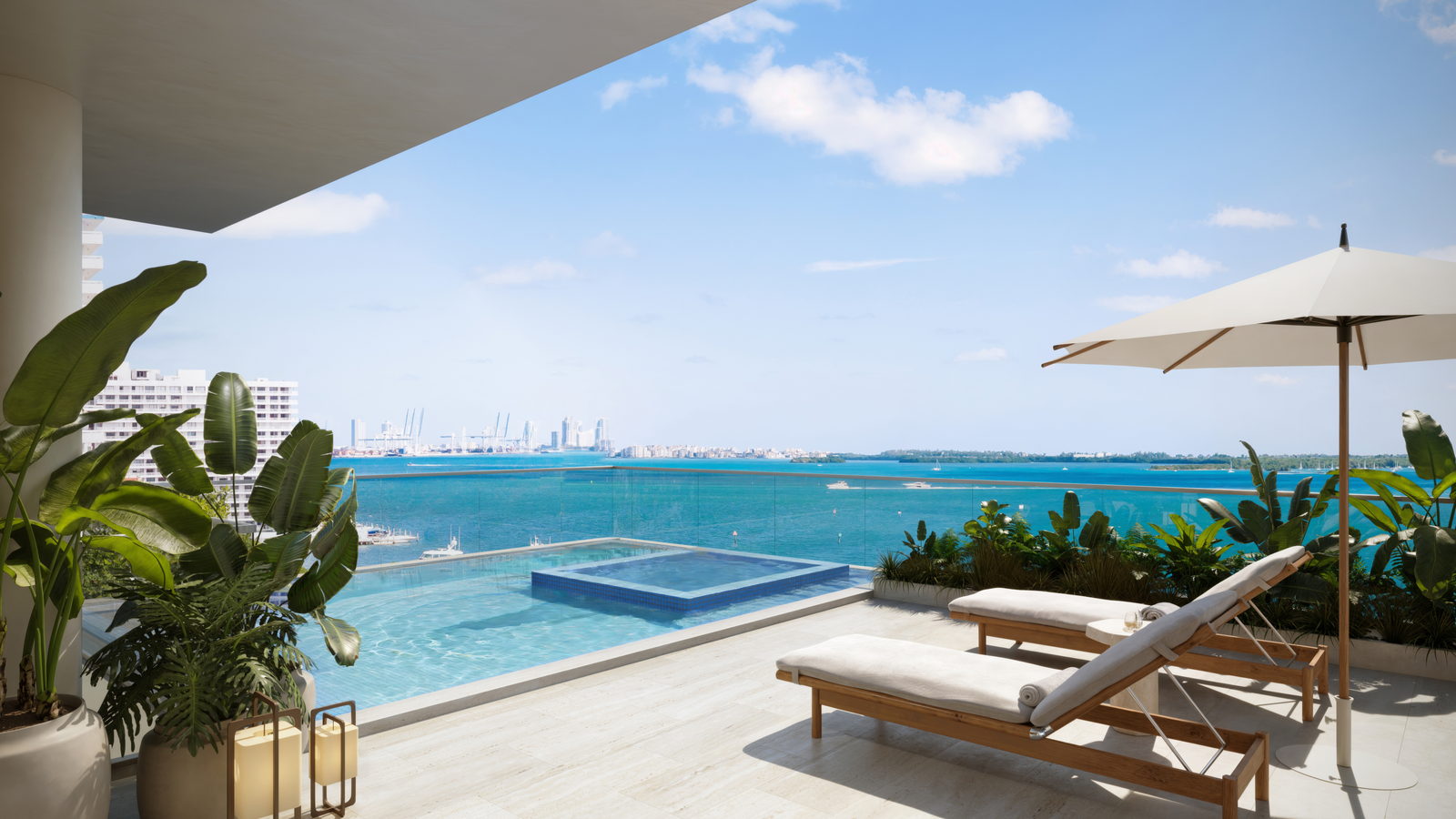 The roof deck of a Villa: a pool with an inset spa, loungers and planting, looking out over Biscayne Bay.