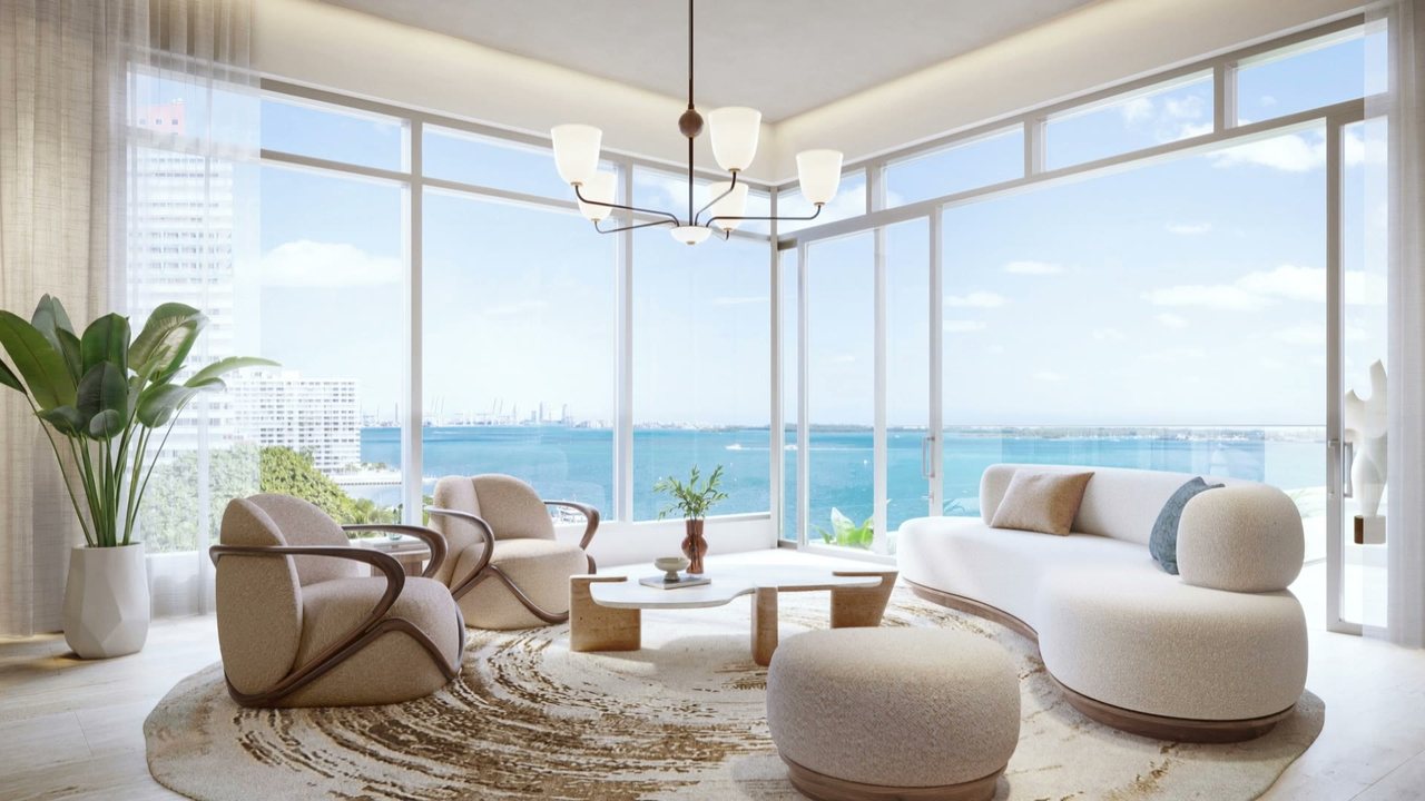 The living room, with glass window walls facing Biscayne Bay.